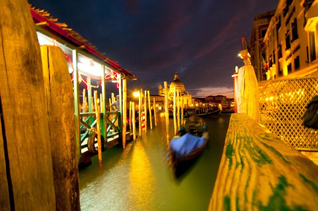 Illuminated buildings against sky at night