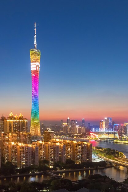 Illuminated buildings in city against sky at night