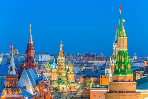 Illuminated buildings in city against sky