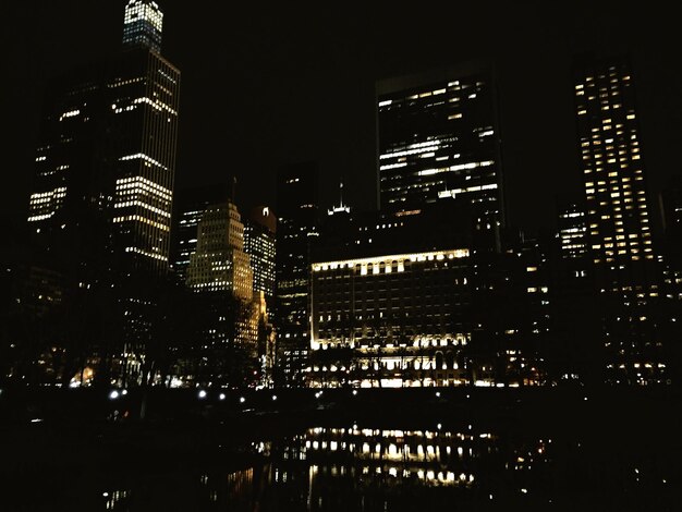 Illuminated buildings in city at night