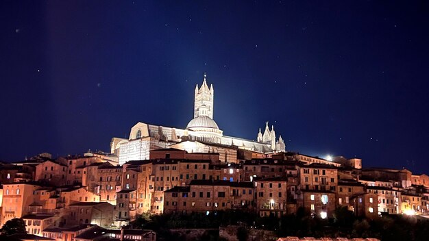 Illuminated buildings in city at night