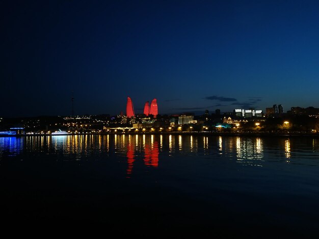 Illuminated buildings at waterfront