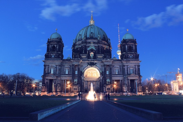 Illuminated church against blue sky