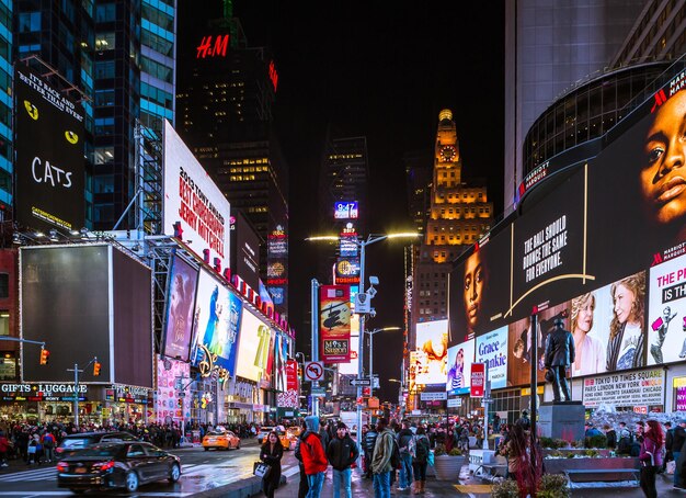 Illuminated city street and buildings at night