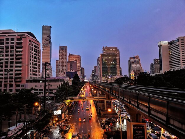 Illuminated city street at dusk