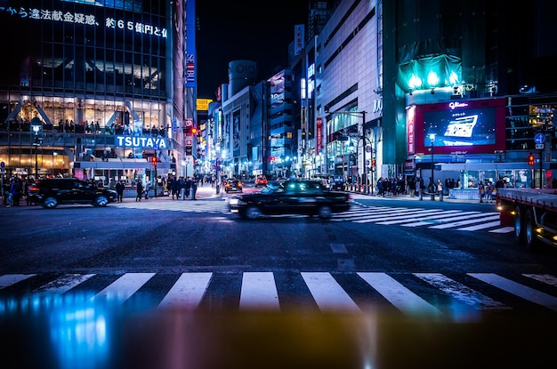 Illuminated city street at night