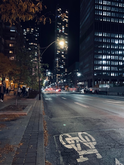 Illuminated city street at night