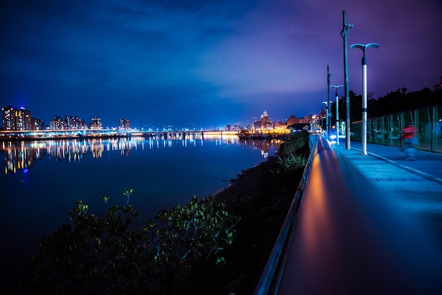 Illuminated city at waterfront