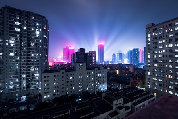 Illuminated cityscape against sky at night