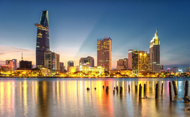 Illuminated cityscape against sky at night