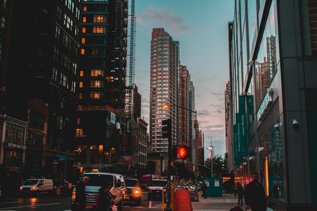 Illuminated cityscape against sky