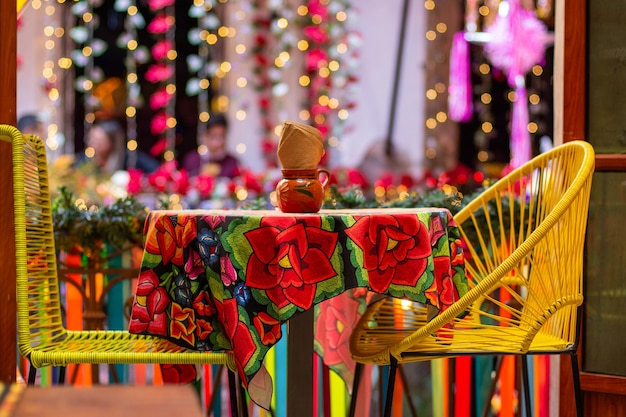 Photo illuminated and colorful mexican dinner table with no people