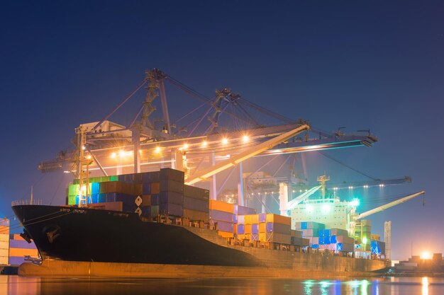 Illuminated commercial dock against sky at night