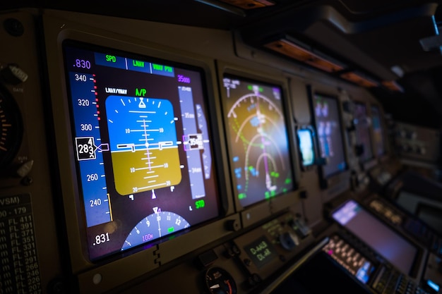 illuminated computers in airplane