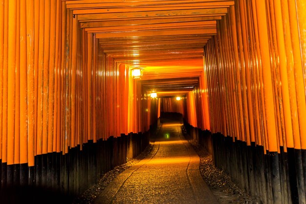 Illuminated corridor of mosque at sunset