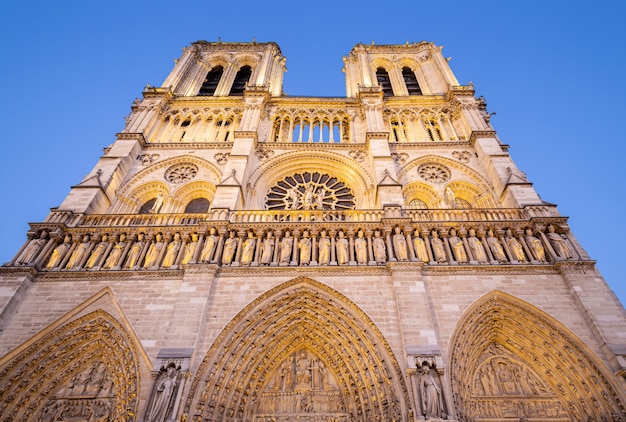 Illuminated facade of Notre Dame de Paris Cathedral