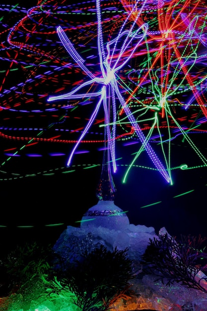 Illuminated ferris wheel at night