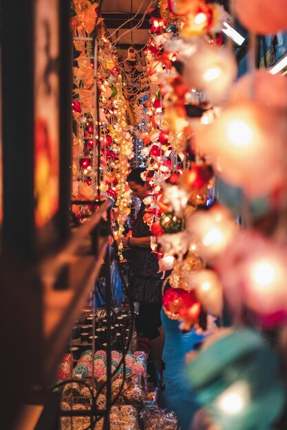 Photo illuminated lanterns hanging in store for sale