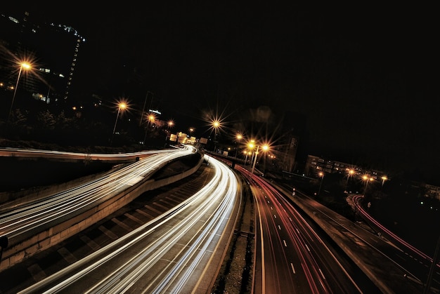 illuminated light trails on street at night