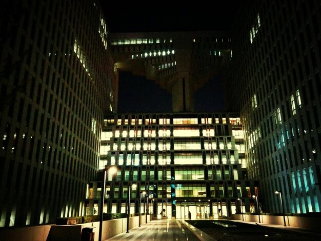 Illuminated modern buildings in city at night