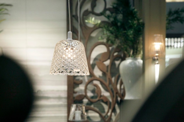 Photo illuminated pendant light hanging in restaurant