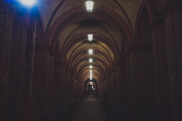 Photo illuminated pendant lights in tunnel