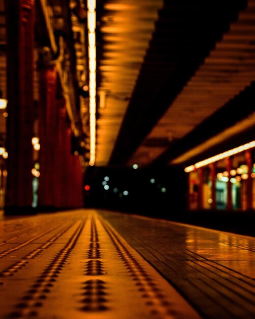 Illuminated railroad station at night