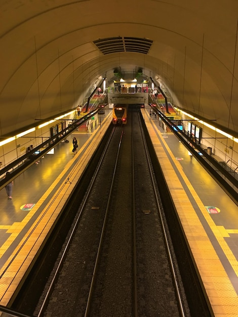 Photo illuminated railroad station platform