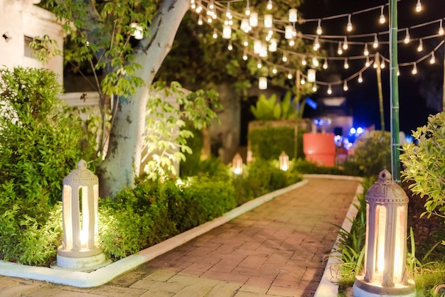 Photo illuminated street light on footpath at night