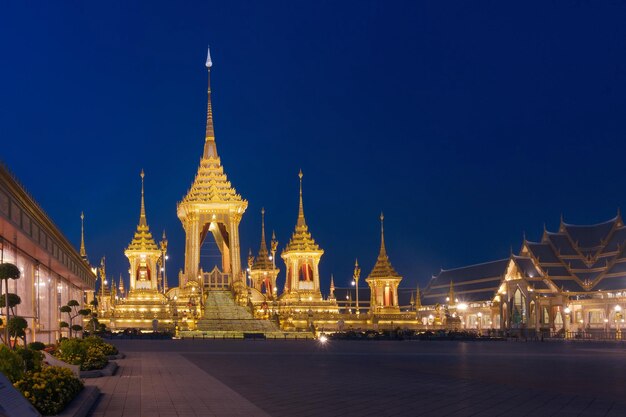 Illuminated temple against clear sky at night