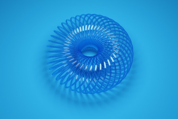 Foto illustrazione di una ruota 3d di una forma insolita in plastica su sfondo blu. campione di forme, meccanismi. nuova cravatta per capelli