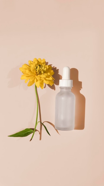 illustration of blank packgaing white glass dropper serum on beige background with yellow flower