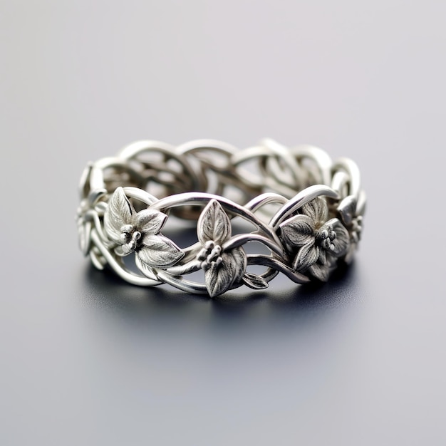 Photo illustration of silver woven ring with floral design