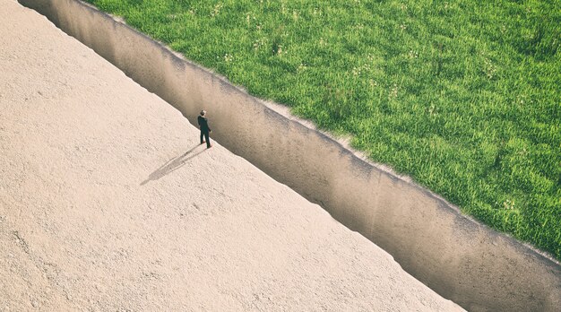 Ilustration van een man die aan de rand van een afgrond staat, 3d-rendering