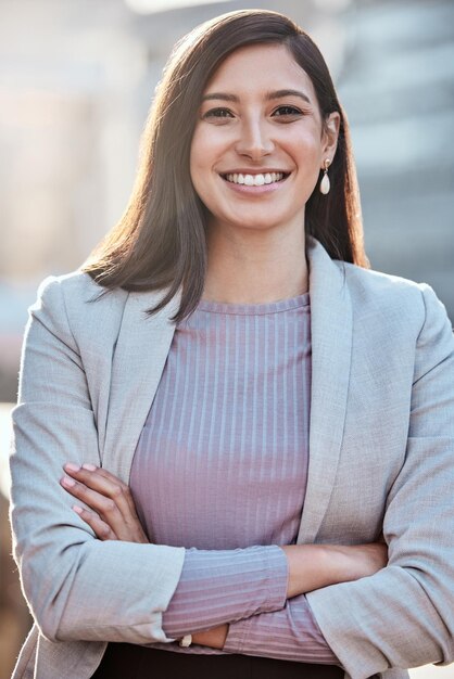 Im determined to be successful in this city Shot of an attractive young businesswomen standing alone outside with her arms folded