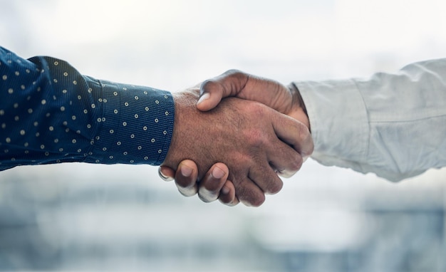 Im glad to have you on board Shot of two colleagues shaking hands in the office