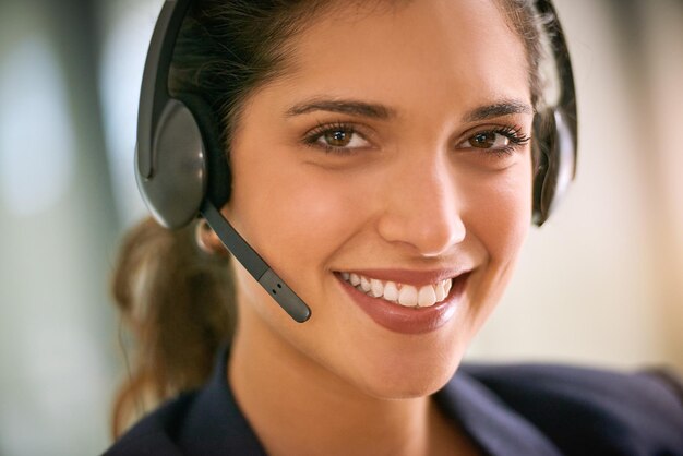 Im happy to help Cropped portrait of an attractive young woman working in a call center