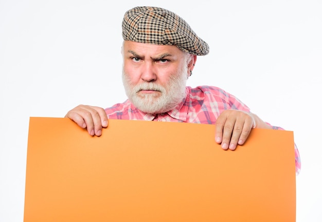 Im not in the mood Advertisement shop serious mature man in retro hat Advertisement wanted Copy space placate information job search Need help Senior bearded man place announcement on banner