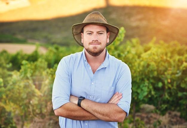 Im my own boss besides for Mother Nature Cropped shot of a middleaged farmer posing on a vineyard