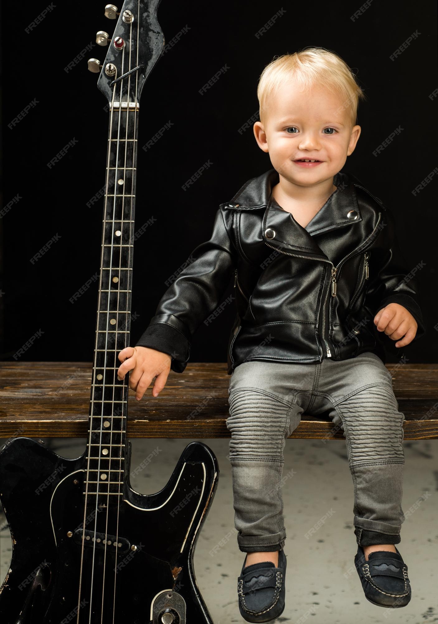 Premium Photo | Im not prince im rock and roll star. child boy with guitar.  little guitarist in rocker jacket. rock style child. rock and roll music  performer. adorable music fan. small