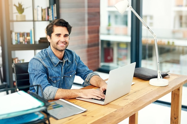 Im ready to grab hold of every business opportunity Portrait of a young designer working on a laptop in a modern office