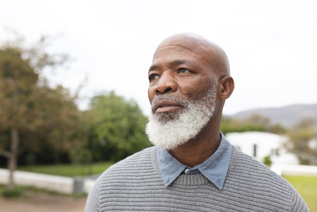 Image of african american senior man posing at camera. Lifestyle and spending time at home and garden concept.