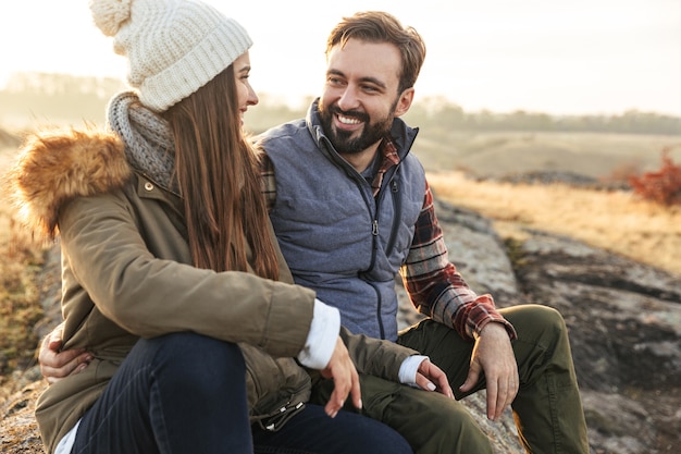 Image of amazing emotional happy young loving couple outside in free alternative vacation camping over mountains.