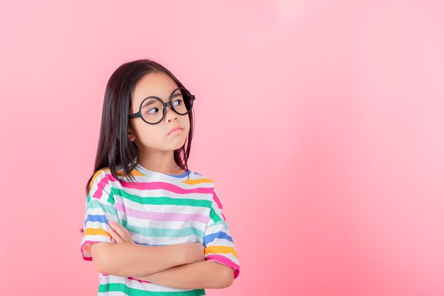 Image of Asian child posing on Pink background