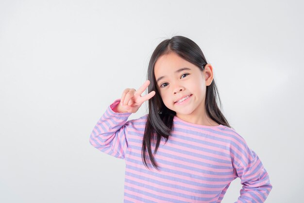 Image of Asian child posing on white background