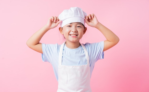 Image of Asian child practicing to be a chef