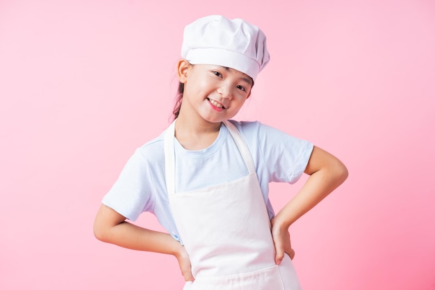 Image of Asian child practicing to be a chef