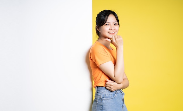 Image asian girl posing with billboard