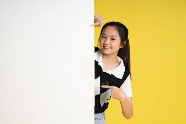 image of asian girl standing with billboard