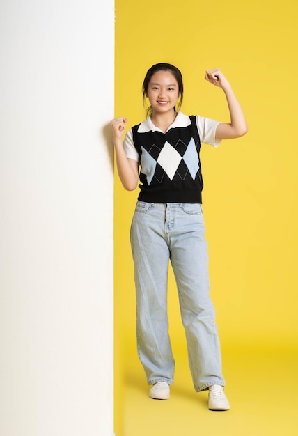 image of asian girl standing with billboard